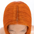 Orange wig on a mannequin head with a white background, Obroi