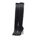 Black knee-high boots with sparkling rhinestone details on a white background, Obroi