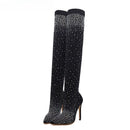 Black knee-high boots with sparkling rhinestone details on a white background, Obroi