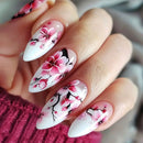 Nails with cherry blossom design on a blurred background, Obroi