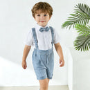 Child wearing a blue checkered outfit with suspenders and a bow tie on a white background, Obroi