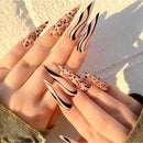 Obroi Nails with leopard print and black wavy design on a neutral background