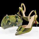 Green studded high-heeled shoes and matching handbag on a white background with 'Obroi' branding.