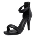 Black high-heeled sandal on a white background, Obroi