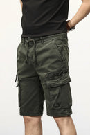 Green cargo shorts worn by a person on a white background, Obroi