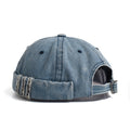 Blue denim cap with worn edge on a white background, Obroi