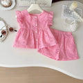 Pink children's outfit on a white surface with accessories, Obroi