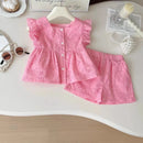 Pink children's outfit on a white surface with accessories, Obroi