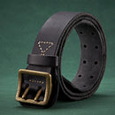 Black leather belt with a brass buckle on a green background, Obroi