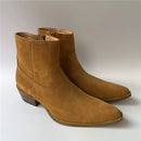 Pair of brown suede ankle boots on a light gray background, Obroi