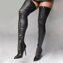 Black leather knee-high boots with detailed lace-up design on a gray background, Obroi