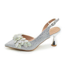 Silver high-heeled shoe with floral design on a white background, Obroi
