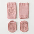 Set of four pink baby socks with textured patterns on a light gray background, Obroi
