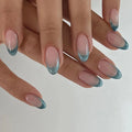 Close-up of hands with pink and blue gradient nails on a white background, Obroi