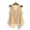 Beige vest on a wooden hanger against a white background, Obroi