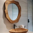 Wooden mirror and sink in a bathroom setting, Obroi