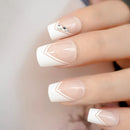 Close-up of a hand with beige and white nail polish on a blurred background, Obroi
