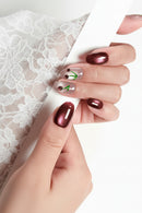 Close-up of a hand with red nail polish on a white background, Obroi