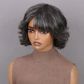Mannequin head with a gray wig on a gray background, Obroi