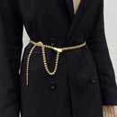 Black coat with a gold belt on a plain background, Obroi