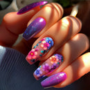 Hand with colorful floral nail art on a blurred background, Obroi