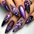 Nails with intricate purple and black designs on a white background, Obroi