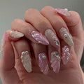 Hand with pink and white decorative nails, Obroi