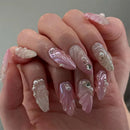 Hand with pink and white decorative nails, Obroi