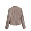 A taupe-brown structured blazer shown from the back, featuring a high mock neck, notched lapels, and decorative gold buttons on the cuffs. The brand name 'Zeralns' is displayed in the top left corner against a solid white background, Obroi