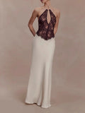 White evening gown with a dark lace bodice on a beige background, Obroi