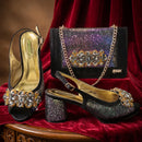 Black high-heeled shoes with crystal embellishments and a matching handbag on a red fabric background, Obroi