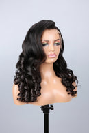 A long, dark brown to near-black wavy wig displayed on a mannequin head against a light gray studio background, Obroi
