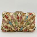 Decorative clutch bag with colorful leaf patterns on a white background, Obroi