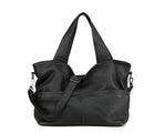 Black leather handbag with a shoulder strap on a white background, Obroi