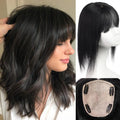 Black wavy wig with straight-cut bangs, shown worn on a model, on a mannequin head, and from underneath to display the attachment base, Obroi
