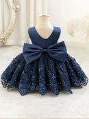 Navy blue lace dress with a large bow on a mannequin against a white background, Obroi