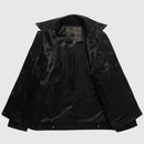 Black jacket with brand label on a light gray background, Obroi