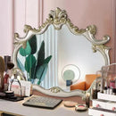 Decorative mirror with ornate frame on a vanity table with makeup items, Obroi