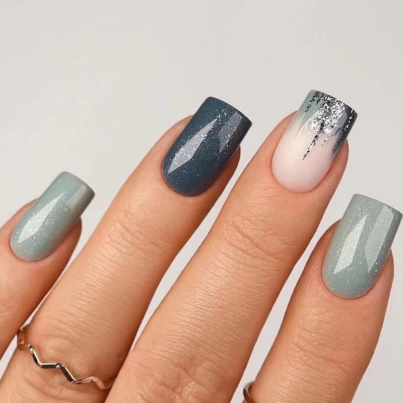 Obroi Nail art with gradient colors on a neutral background