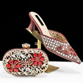 Decorative shoe and matching clutch with intricate designs on a white background, featuring the Obroi brand.