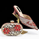 Decorative shoe and matching clutch with intricate designs on a white background, featuring the Obroi brand.