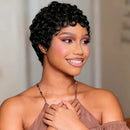 Woman with styled hair wearing a brown top against a neutral background, Obroi