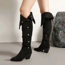Black knee-high boots with decorative elements on a neutral background, Obroi