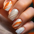 Nails with orange and white marbled design on a neutral background, Obroi