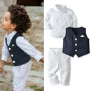 Child wearing a formal outfit with a white shirt, navy vest, and white pants, with a close-up of the outfit on a white background, Obroi