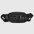 Black leather waist bag with multiple zippers on a light gray background, Obroi
