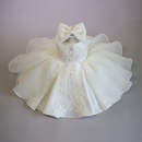 White lace dress with a bow on a gray background, Obroi