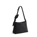 Black shoulder bag with a bow detail on a white background, featuring the Obroi brand.