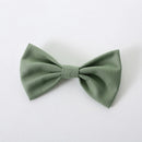Green bow tie on a white background with 'Obroi' branding.