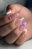 Close-up of a hand with decorative nails featuring pink, white, and purple colors, Obroi